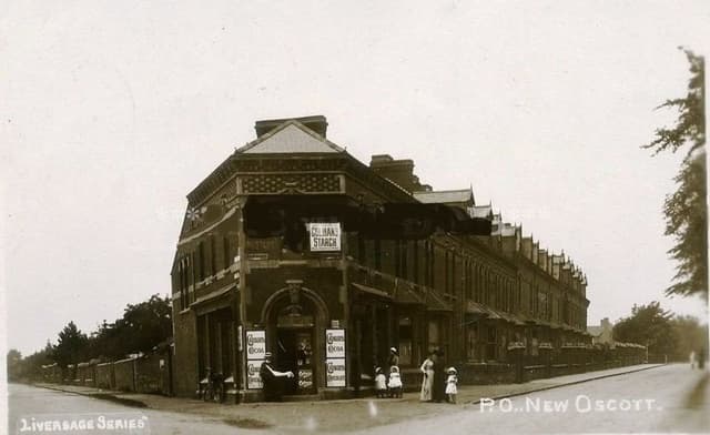 Edwardian postcard of the corner post office and shop at New Oscott in 1903, with people standing outside
