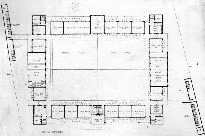Architectural ground-floor plan of a school, with classrooms and verandahs arranged around a large rectangular courtyard.