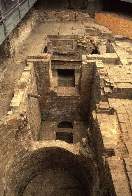 Brick and stone foundations of a demolished engine house.