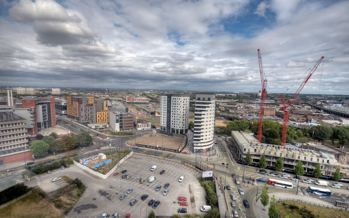 A view over open development land and new apartment blocks.
