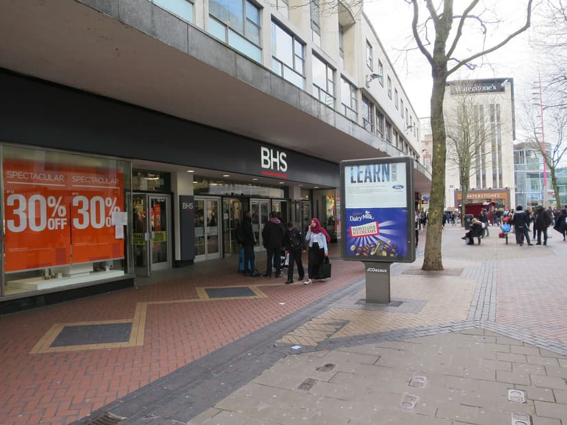 A large modern shop building on a pedestrian street.