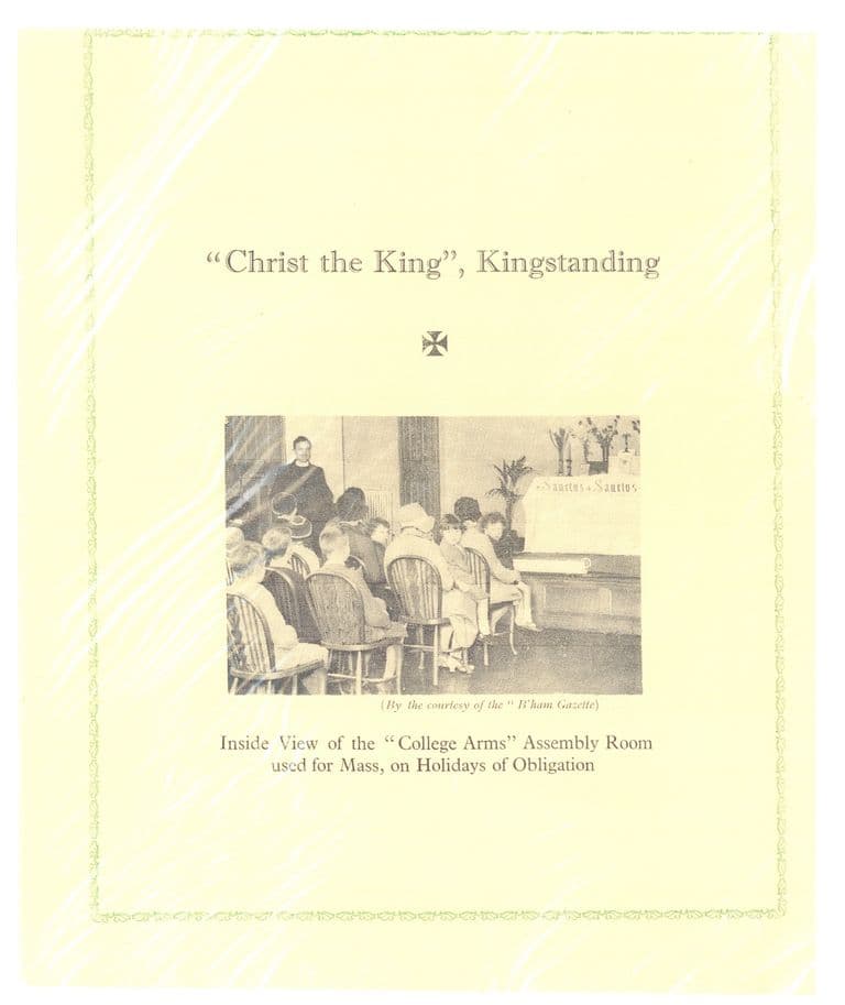 A page from a parish year book headed “‘Christ the King’, Kingstanding”, printed with a photograph of a congregation seated on wooden chairs before a draped altar lettered “Sanctus”, with a priest standing at the back. The caption reads “Inside View of the ‘College Arms’ Assembly Room used for Mass, on Holidays of Obligation” and the photo is marked “By the courtesy of the ‘B’ham Gazette’”.