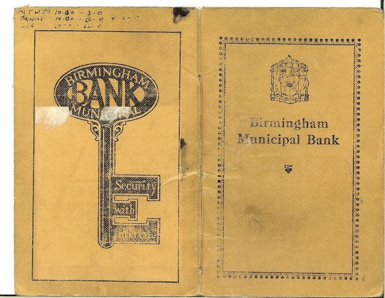 The worn orange card covers of a bank book: the front has the city arms and “Birmingham Municipal Bank” in a dotted border; the back shows a large key with the bank’s oval badge and “Security with Interest”. Opening hours are pencilled at the top.