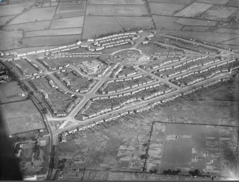 Aerial photograph of 1926 showing the Perry Common estate under construction, with building sites around its central circle and fields and allotments around it