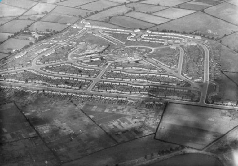 Aerial photograph of 1926 looking across the new Perry Common estate and its central circle, with fields beyond and allotments in the foreground