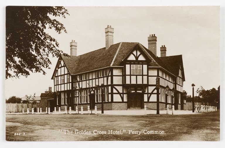 Sepia postcard of the Golden Cross Hotel, Perry Common, a large new mock-Tudor pub with tall chimneys