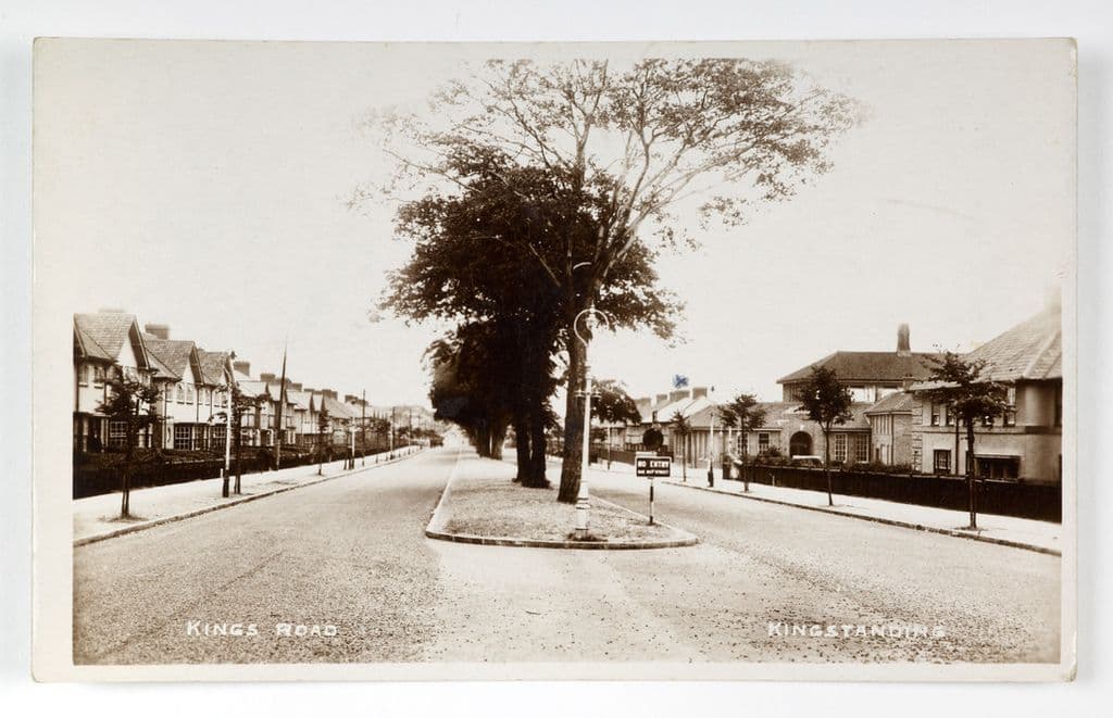 1930s: Sepia postcard of Kings Road, Kingstanding, with a tree-lined central island and new houses on both sides