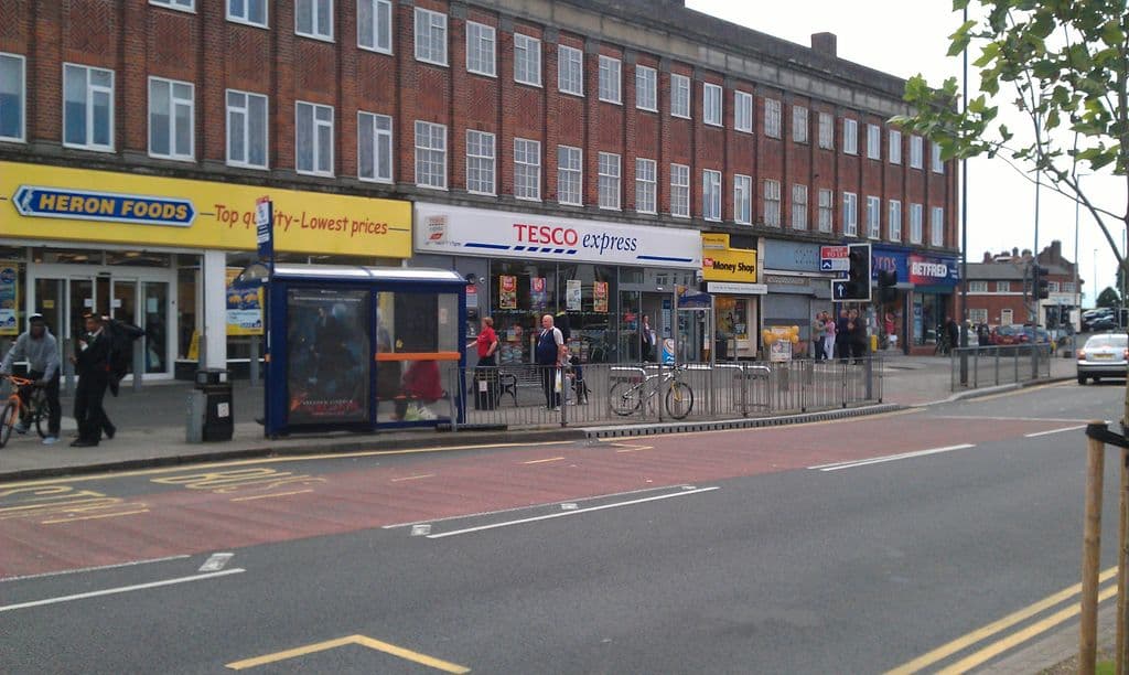 2012: The long three-storey brick shopping block on Hawthorn Road in July 2012, with Heron Foods and Tesco Express at street level