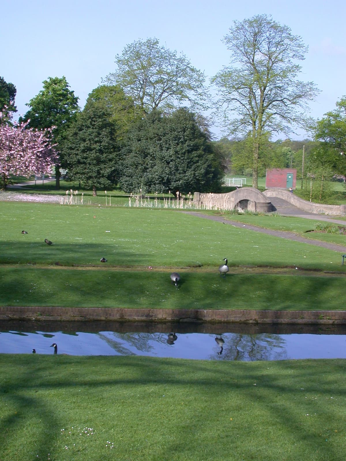 The water-filled moat of Perry Hall in Perry Hall Park.