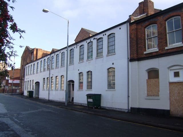 A street of brick industrial buildings and workshops in the Gun Quarter.