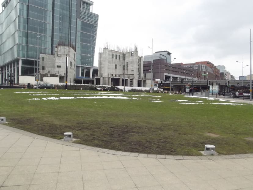 City road junction with new office towers behind.