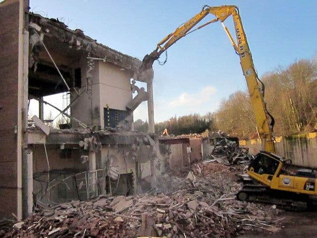 Large factory building partly demolished.