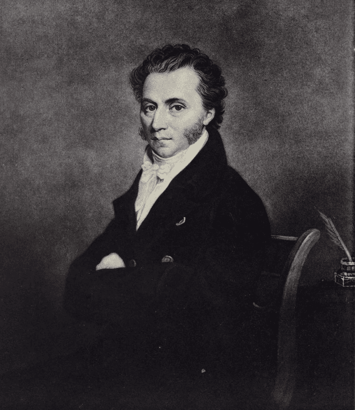 Engraved portrait of a seated man with dark curly hair and side whiskers, in a dark coat and white neckcloth, his arms folded.