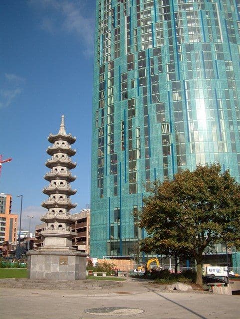 A large roundabout with a Chinese pagoda on its central island.