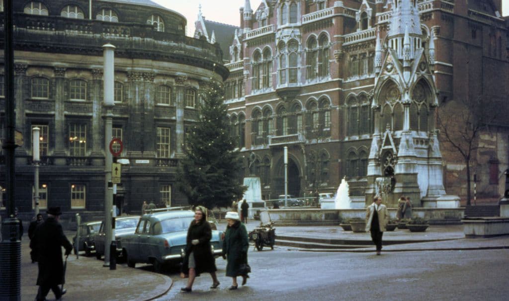Photograph across Chamberlain Square showing the Gothic Chamberlain Memorial, with the Reference Library on the left and Mason College behind.