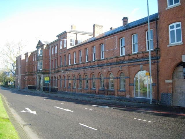 Red-brick front of the former mint seen from Icknield Street before conversion.