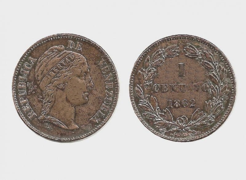Both sides of a worn copper coin with a woman’s head and a wreath around the value.