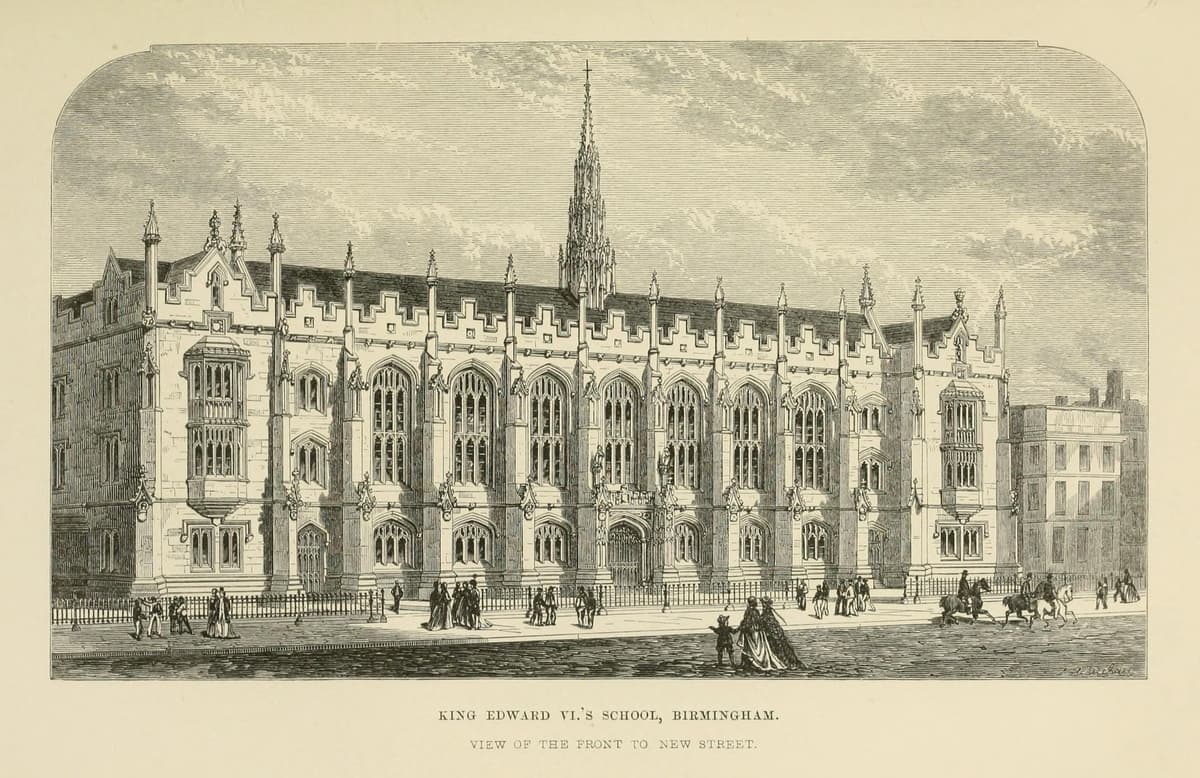 Engraving of a Gothic school front with traceried windows, pinnacles and a small spired lantern in the middle of the roof.