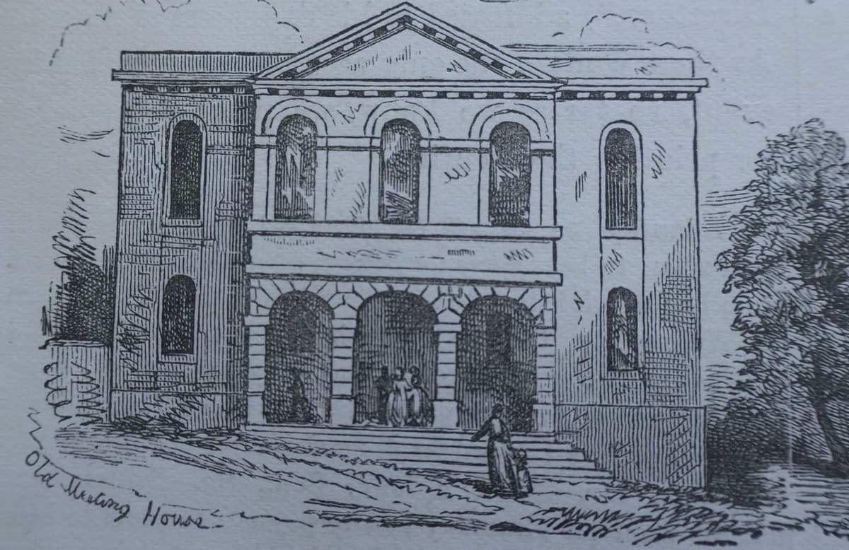 Engraving of a Georgian brick chapel with a pedimented centre, three tall arched upper windows and a porch of three arches reached by steps.
