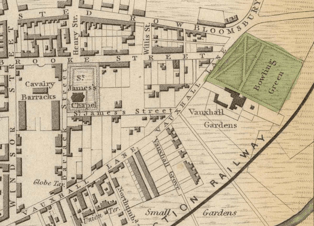 Detail of an engraved street map showing a garden with a bowling green beside a lane and a railway line.