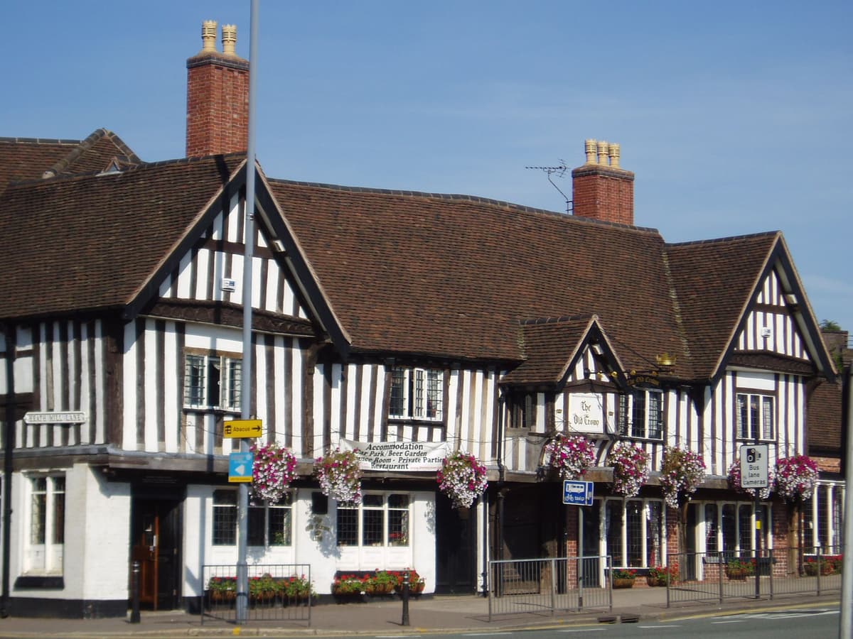 The timber-framed Old Crown Inn on a city street.