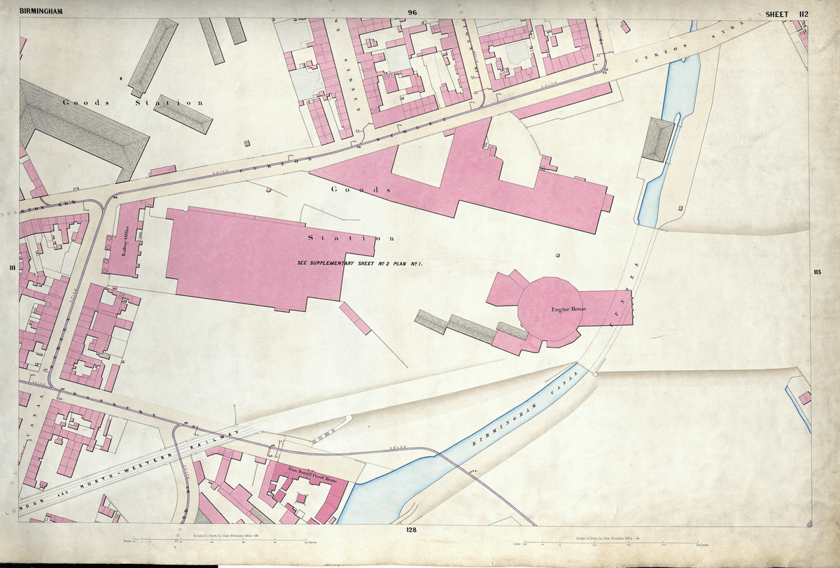 Detailed 1850s survey map of railway buildings and tracks beside a canal, with a round sixteen-sided engine house.