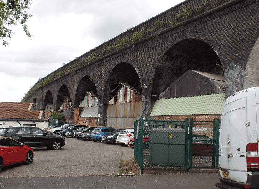 Brick railway arches over a Digbeth street.