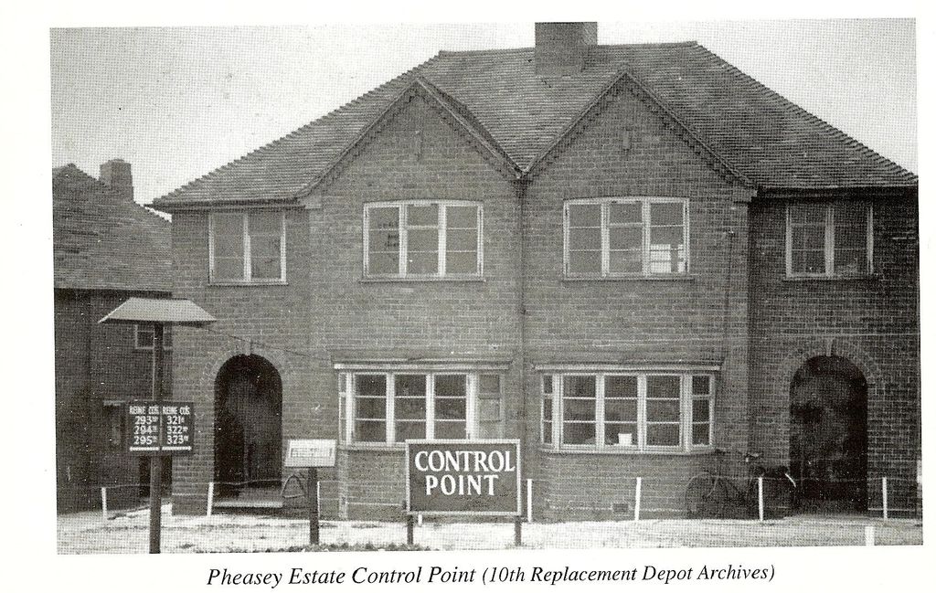 A scan of a book page: a pair of brick semi-detached houses with a large sign in front reading “Control Point”, a board listing Reinforcement Companies 293rd to 295th and 321st to 323rd, and bicycles by the porch. The printed caption reads “Pheasey Estate Control Point (10th Replacement Depot Archives)”.