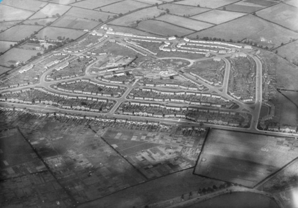 Aerial photograph of 1926 looking across the new Perry Common estate and its central circle, with fields beyond and allotments in the foreground