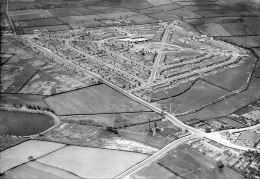 Aerial photograph of 1927 showing the Perry Common estate more complete, with a large new building near its centre, fields all around and the Witton Lakes reservoir