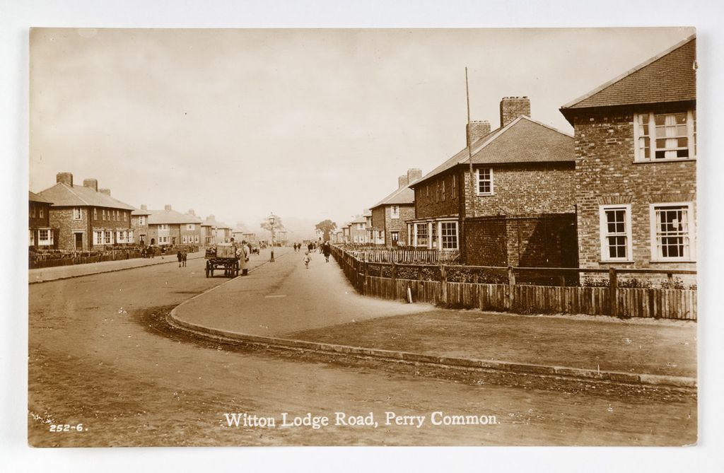 Sepia postcard of Witton Lodge Road, Perry Common: new brick houses behind wooden fences and a horse and cart on the long road