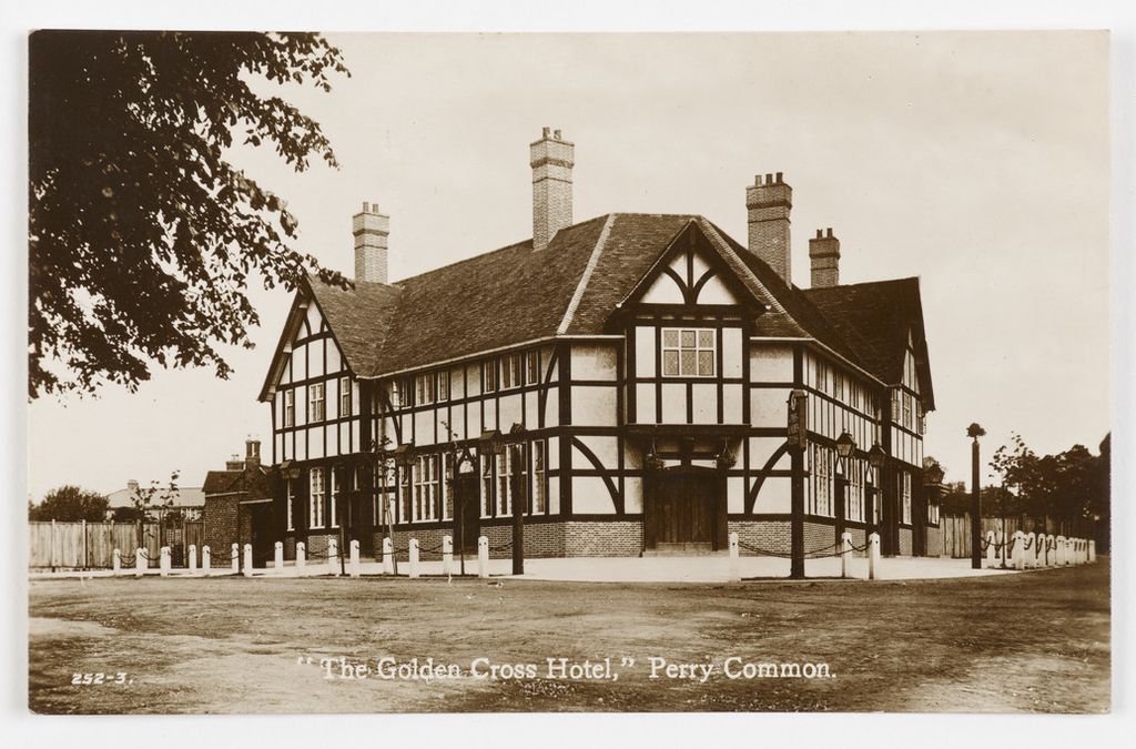 Sepia postcard of the Golden Cross Hotel, Perry Common, a large new mock-Tudor pub with tall chimneys
