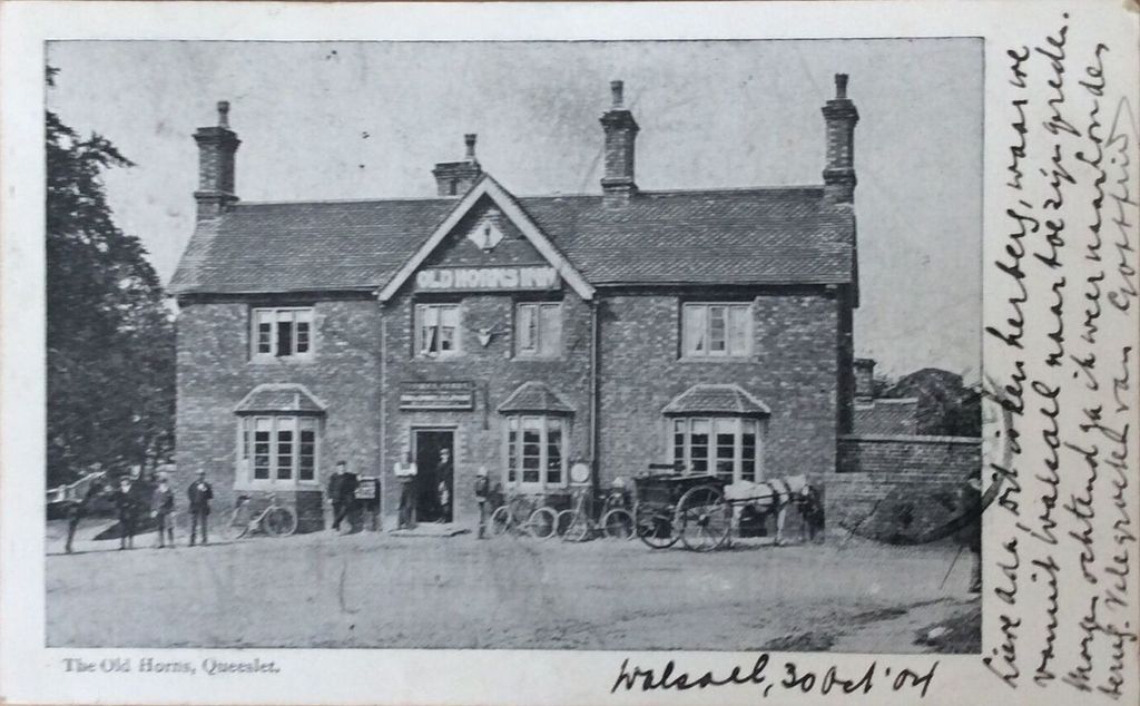 Postcard of the Old Horns inn at Queslett in 1904, with carts, bicycles and men standing outside