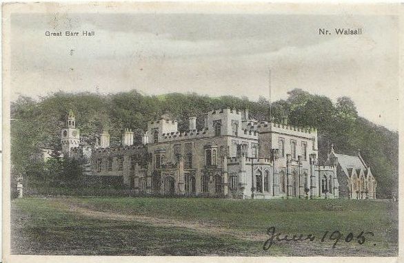 Old postcard view of a large Gothick country house with pointed windows and battlements, beside trees.