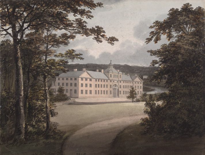 Watercolour of a long, pale factory building with a central bay, seen along a drive between tall trees.