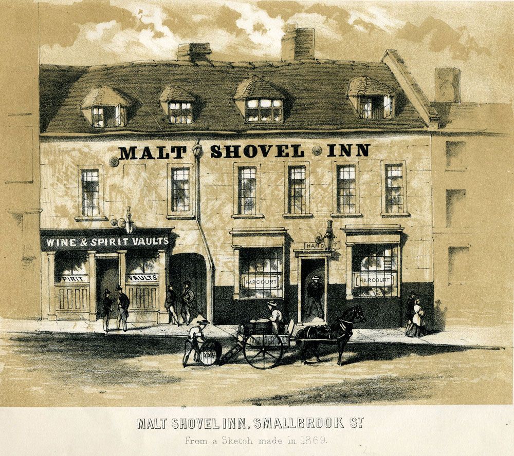 Engraving of a low old inn with a sign, between taller buildings on a town street.