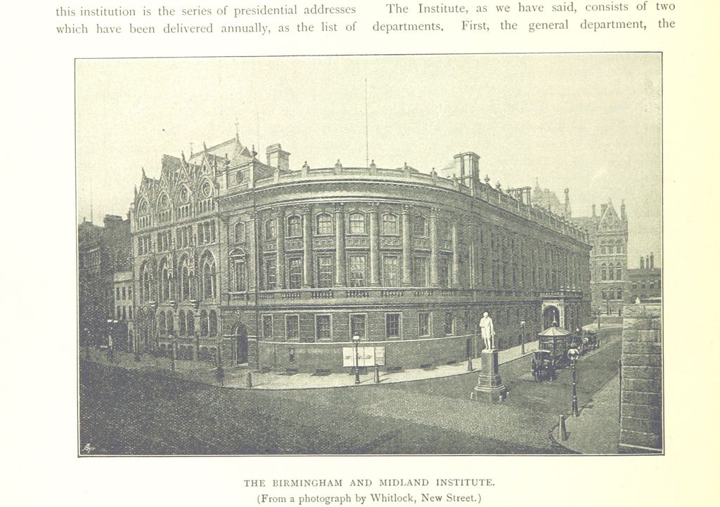 Photograph of a three-storey Renaissance building with a rounded corner, a statue in the street before it and a Gothic wing beyond.