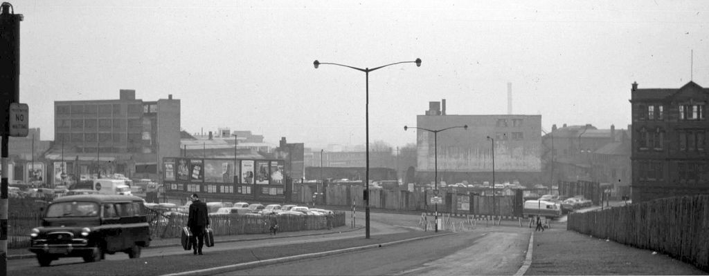 Photograph of a newly built dual carriageway running downhill.