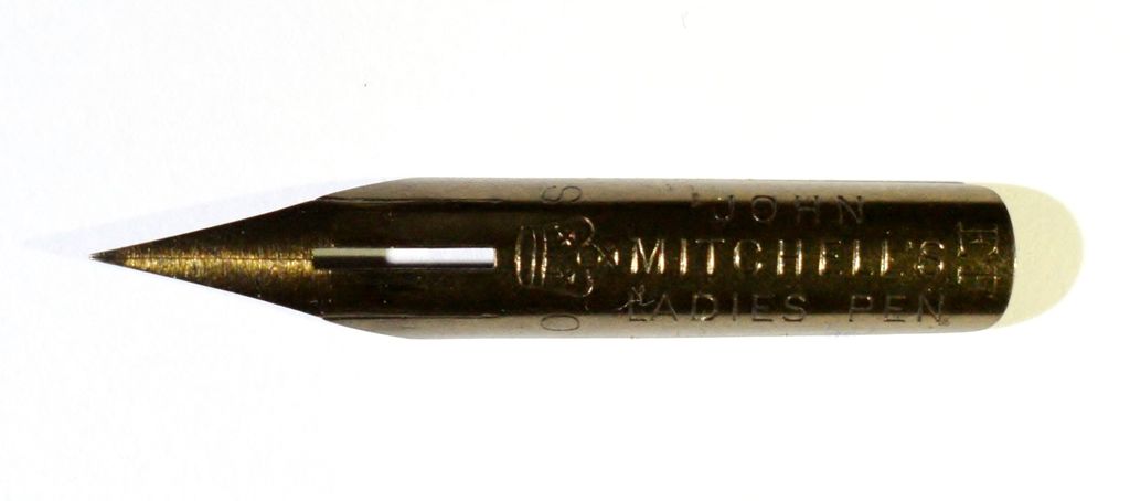 Close-up of a slender bronze-coloured steel nib stamped John Mitchell’s Ladies Pen.