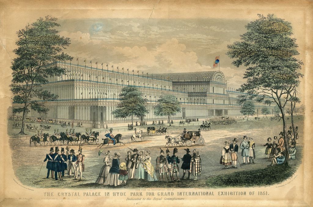 Engraving of a huge glass building with an arched transept, seen from a road with carriages and people.