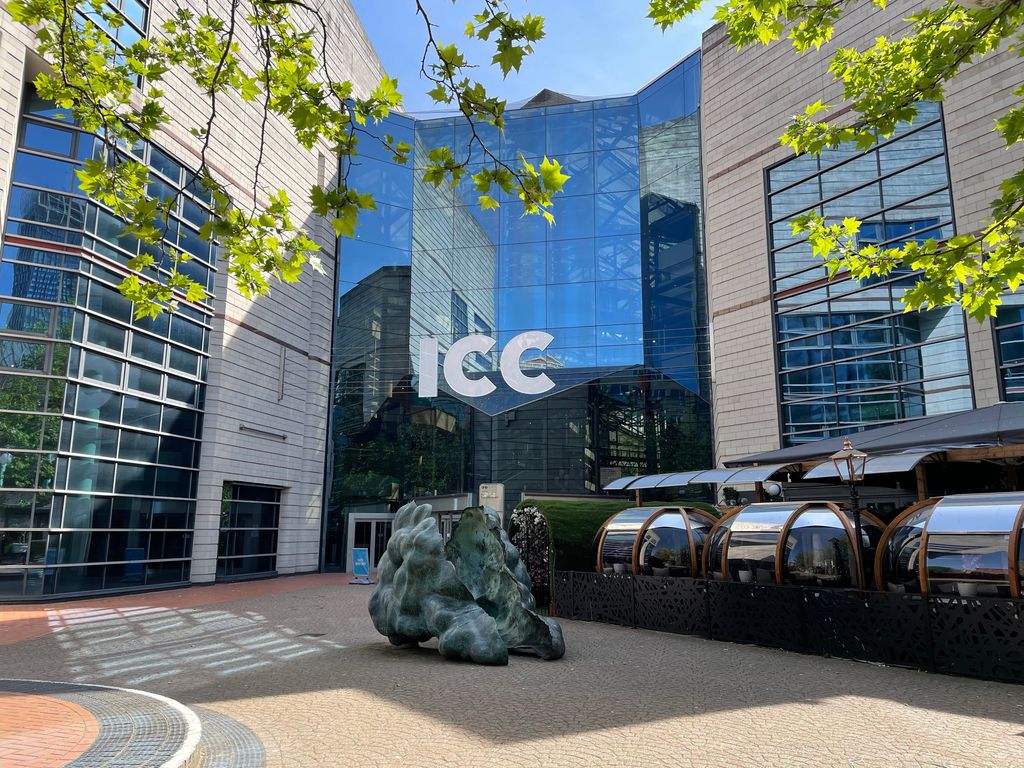 Exterior of a large modern glass and brick convention centre.