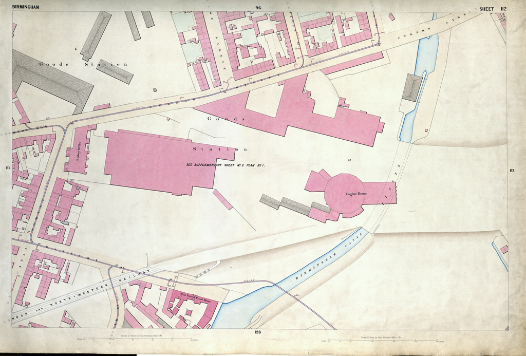 Detailed 1850s survey map of railway buildings and tracks beside a canal, with a round sixteen-sided engine house.