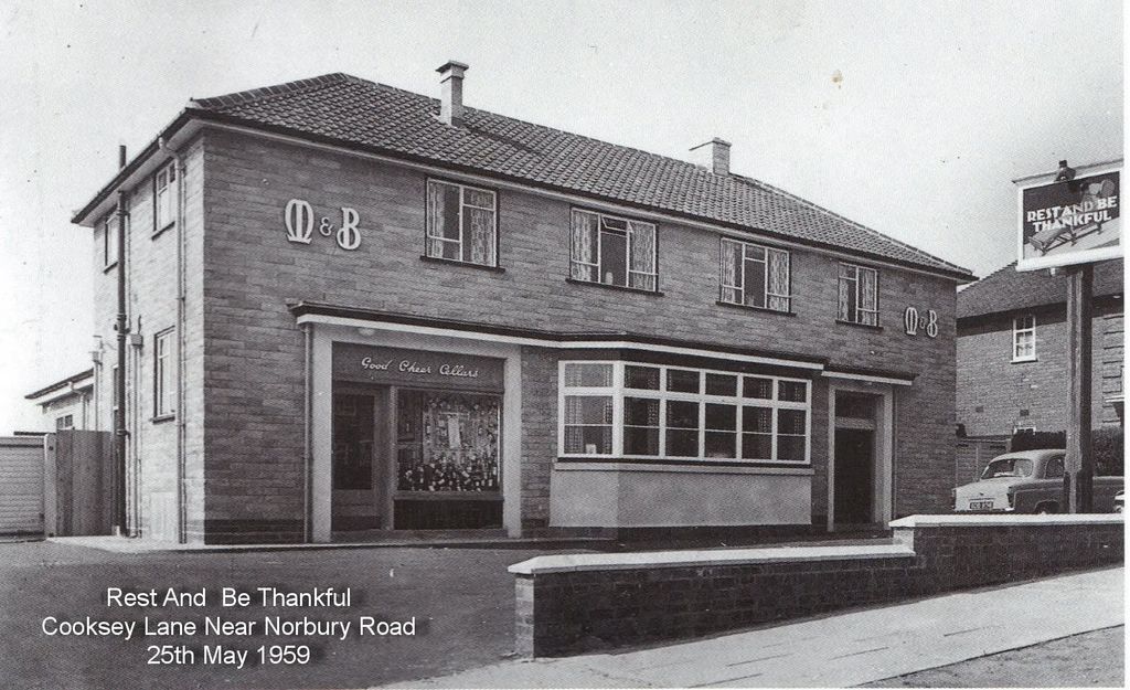 A new two-storey Mitchells & Butlers pub with M&B lettering, a Good Cheer Cellars off-licence window and a hanging sign reading Rest and Be Thankful